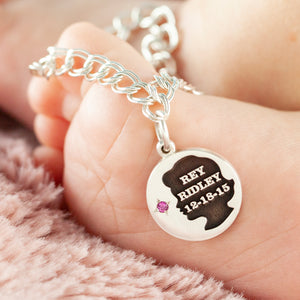 round baby girl charm with name, birth date and birth stone